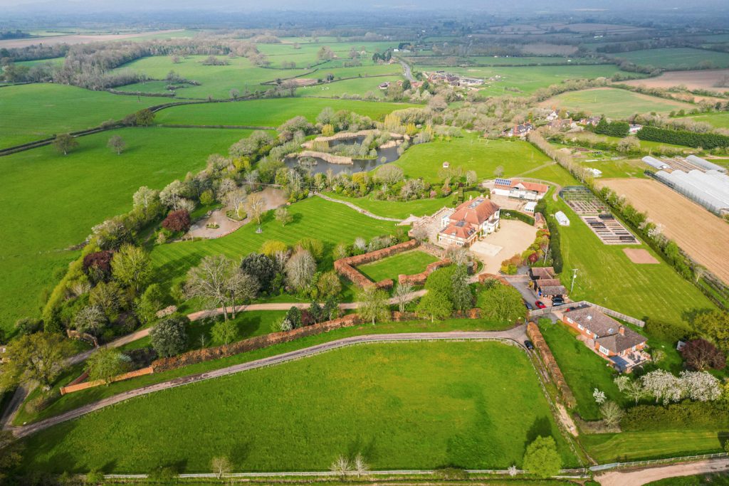 Drone image of large country estate with energy efficient solar panels