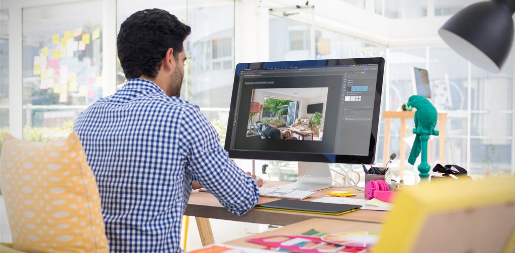 Photo enhancing header image man using photoshop